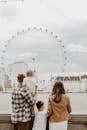 Family Looking at London Eye in London, UK