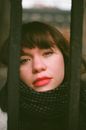 Portrait of a Woman behind Bars