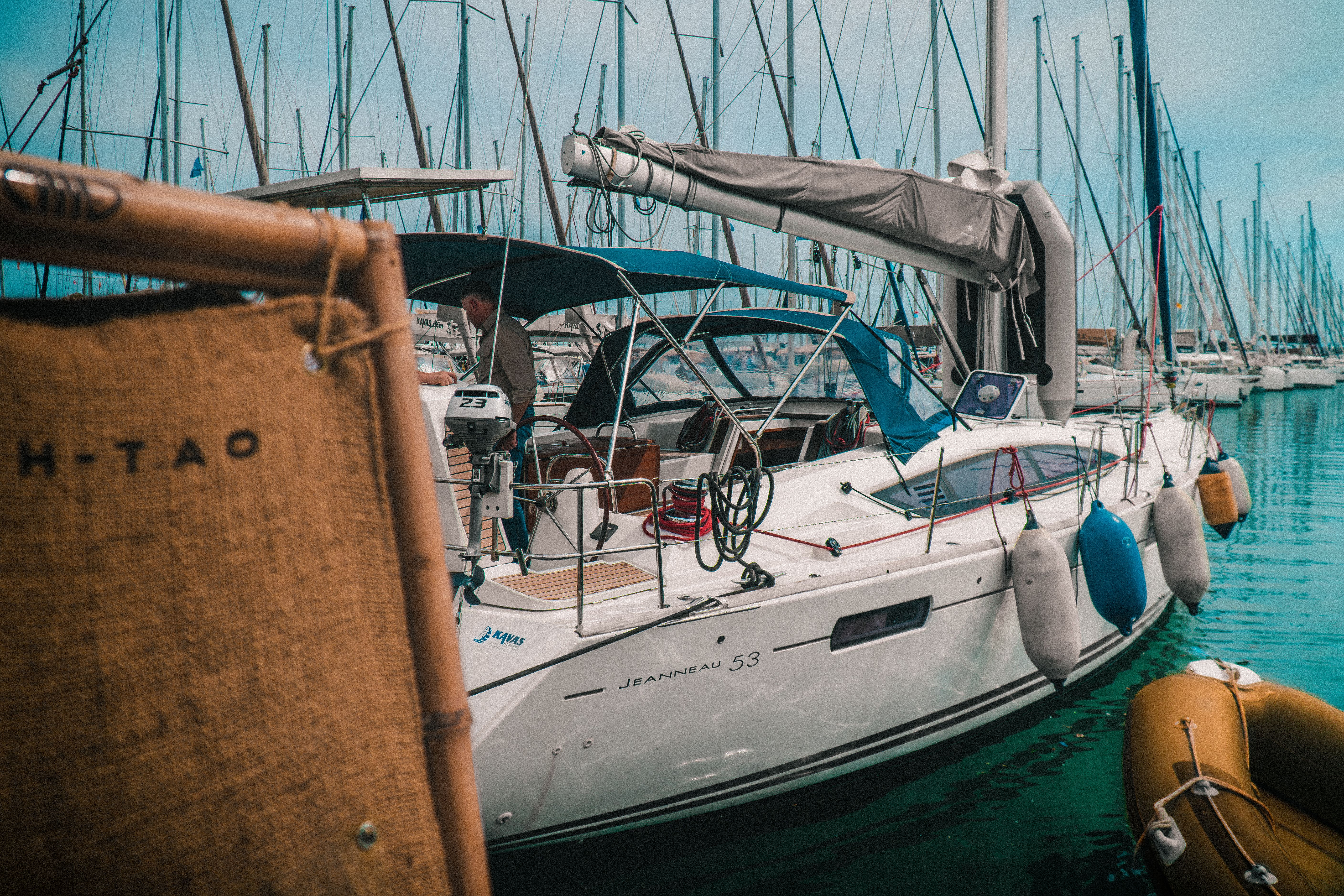 Unbeatable Diamond Head Sunset Sail Review: Hawaii's Most Romantic Yacht Experience Review 2026 - A sleek sailboat docked at a marina in Athens, Greece, surrounded by calm waters and other vessels.