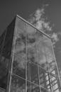 Grayscale Photo of a Glass Building