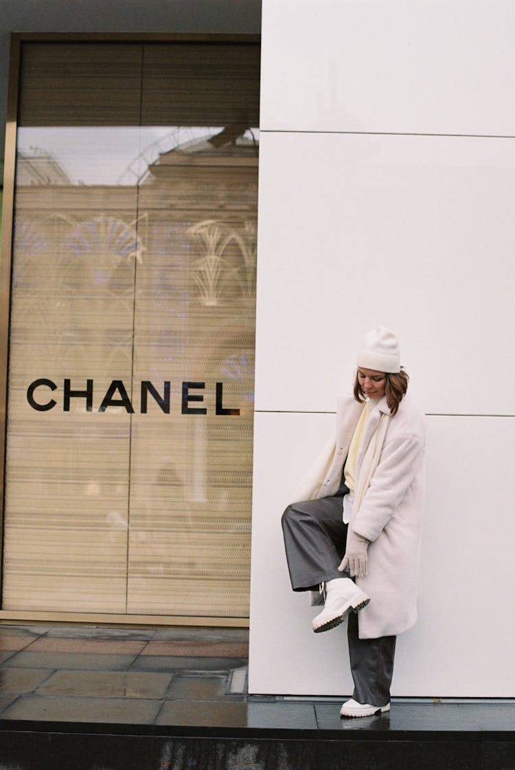 A Woman Standing Outside Chanel Store