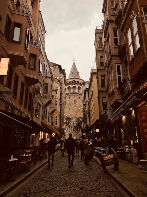 People Walking on Street Near the Galata Tower in Istanbul, Turkey