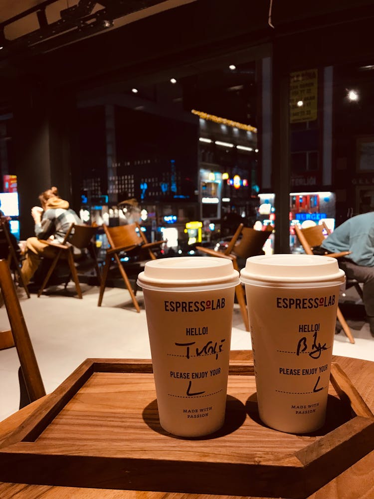 Disposable Paper Cups On Brown Wooden Tray