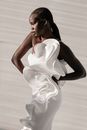 Afro-American Female Model in White Dress with Ruffles