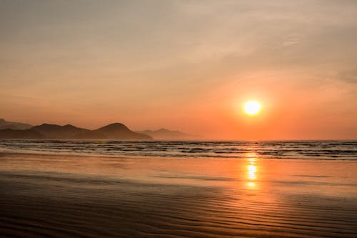 Free Scenic View of a Beach during Sunset Stock Photo
