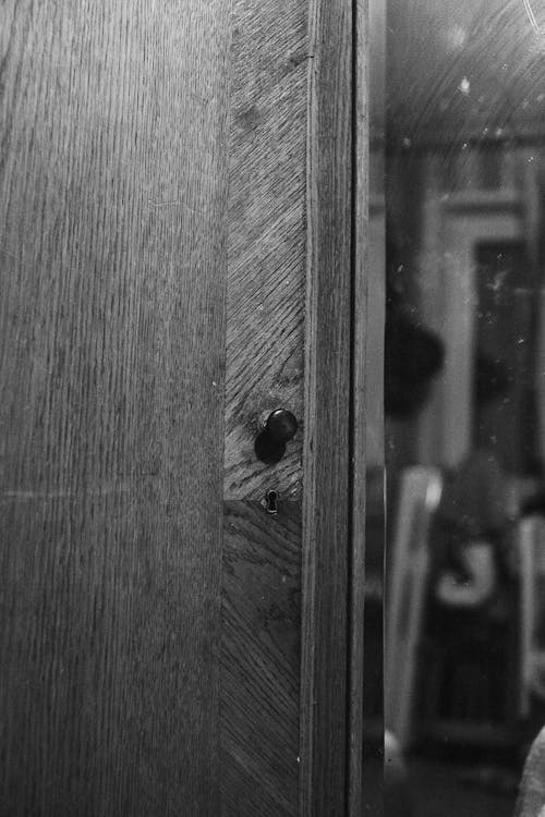 Grayscale Photography of a Wooden Door