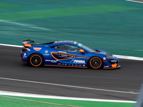 A Blue Racecar on a Race Track