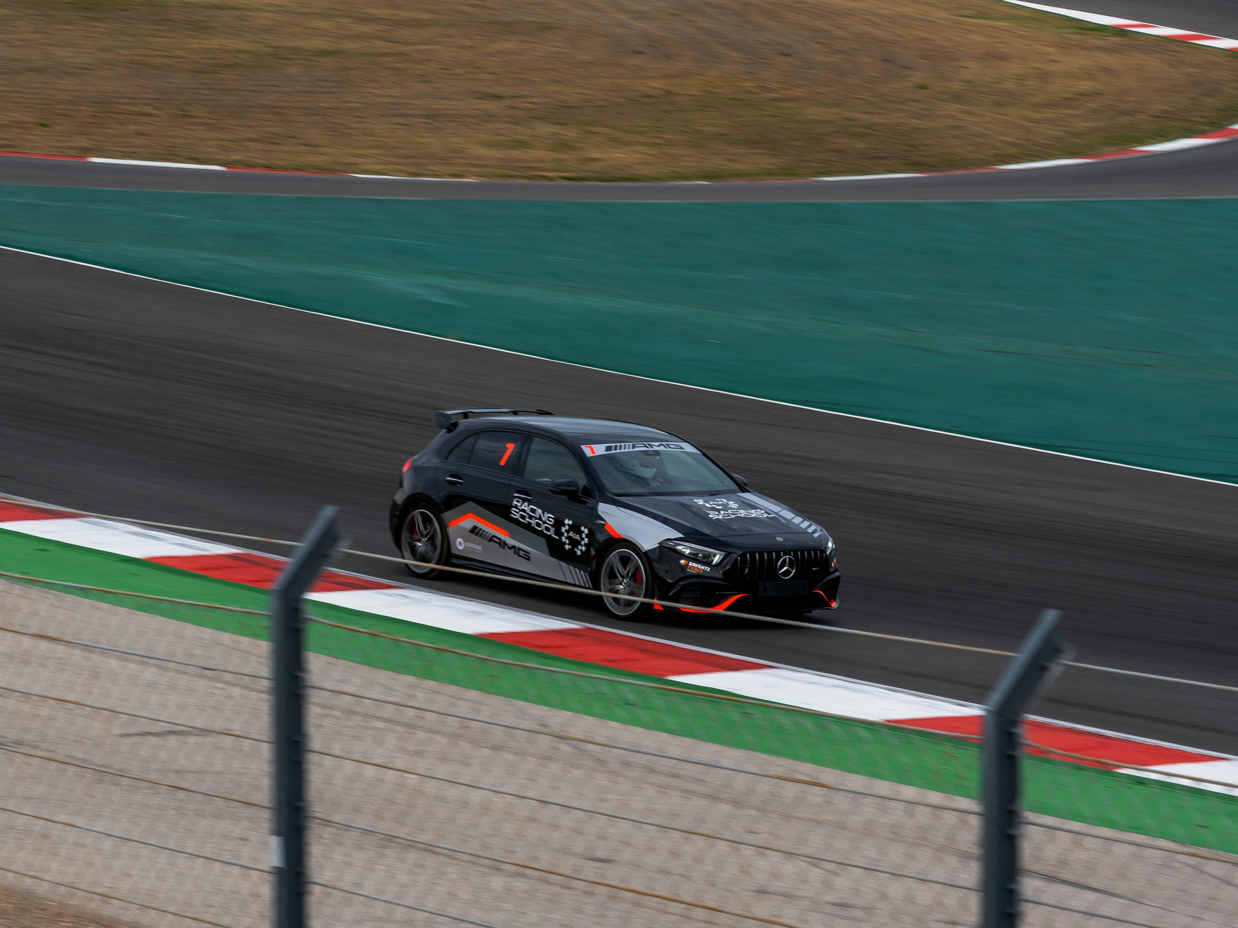 Free A high-speed race car maneuvering the track at Portimão Circuit, Portugal. Stock Photo