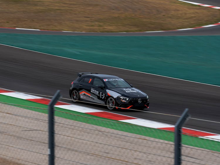 A Black Racecar On A Race Track