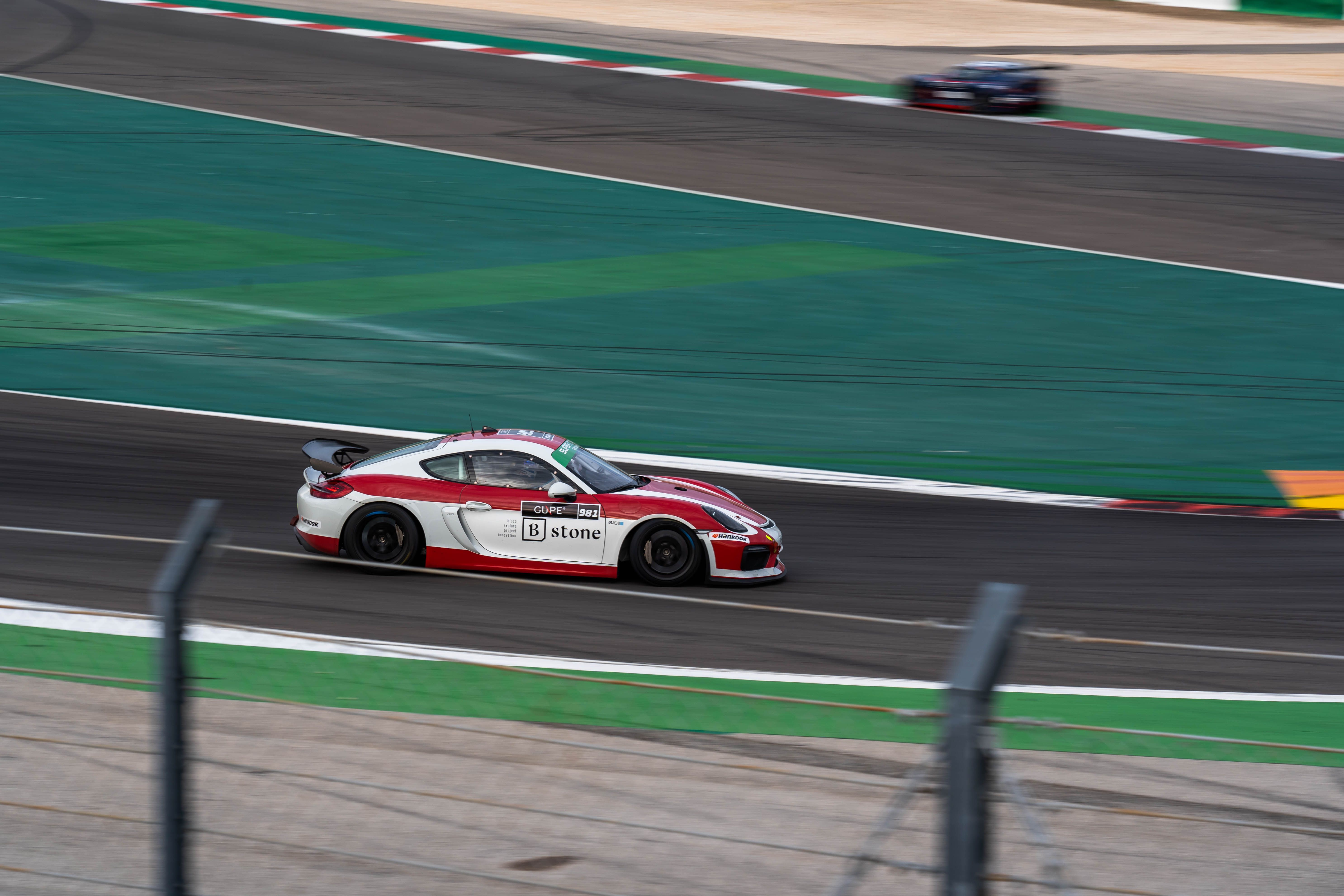 Blume Racing Blue Racing Car on Track · Free Stock Photo