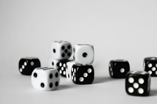 Free Close-Up Photo of Black and White Dice with White Background Stock Photo