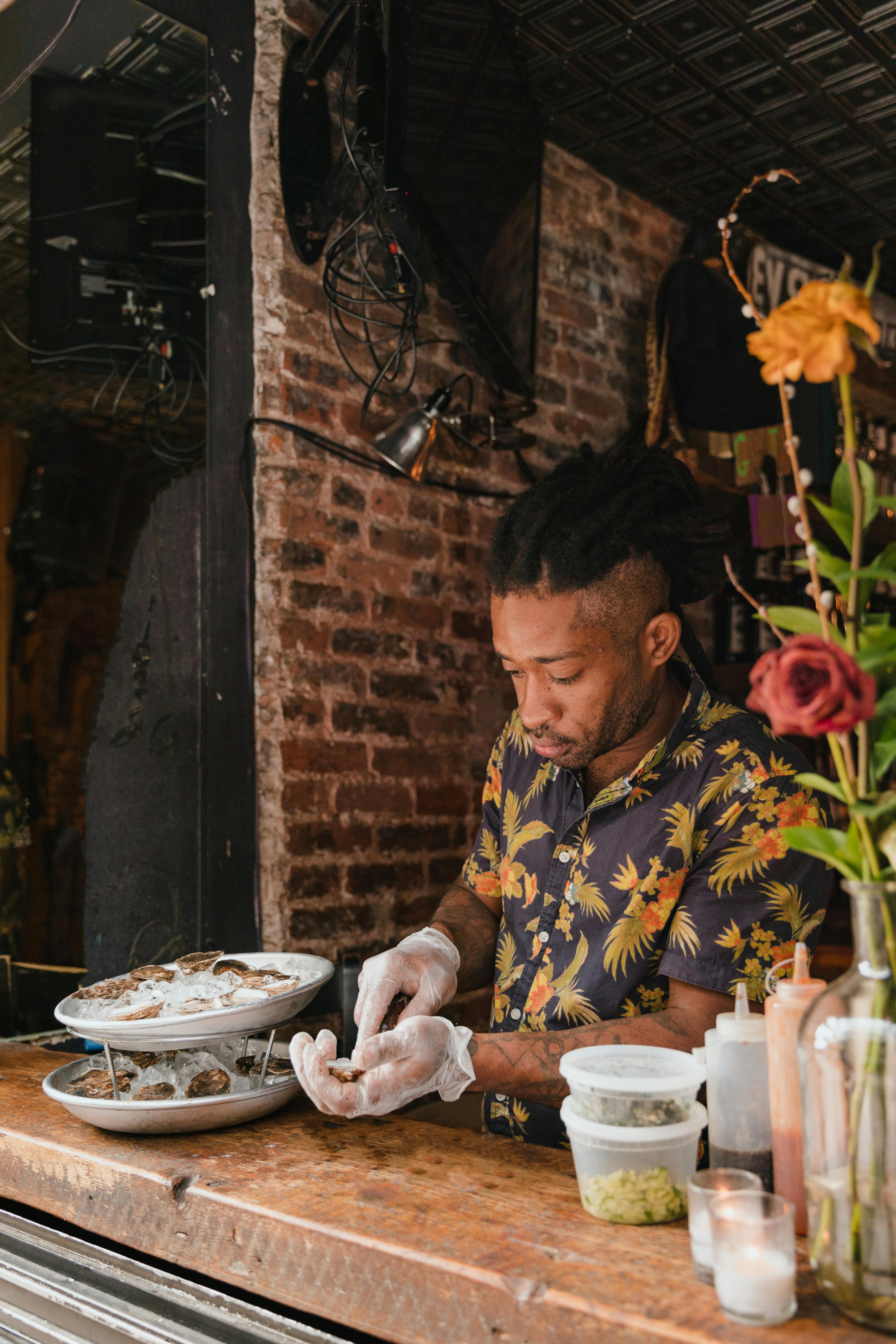 man in gloves preparing food