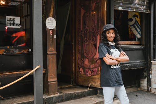 Portrait of Smiling Female Owner in Front of Cafe