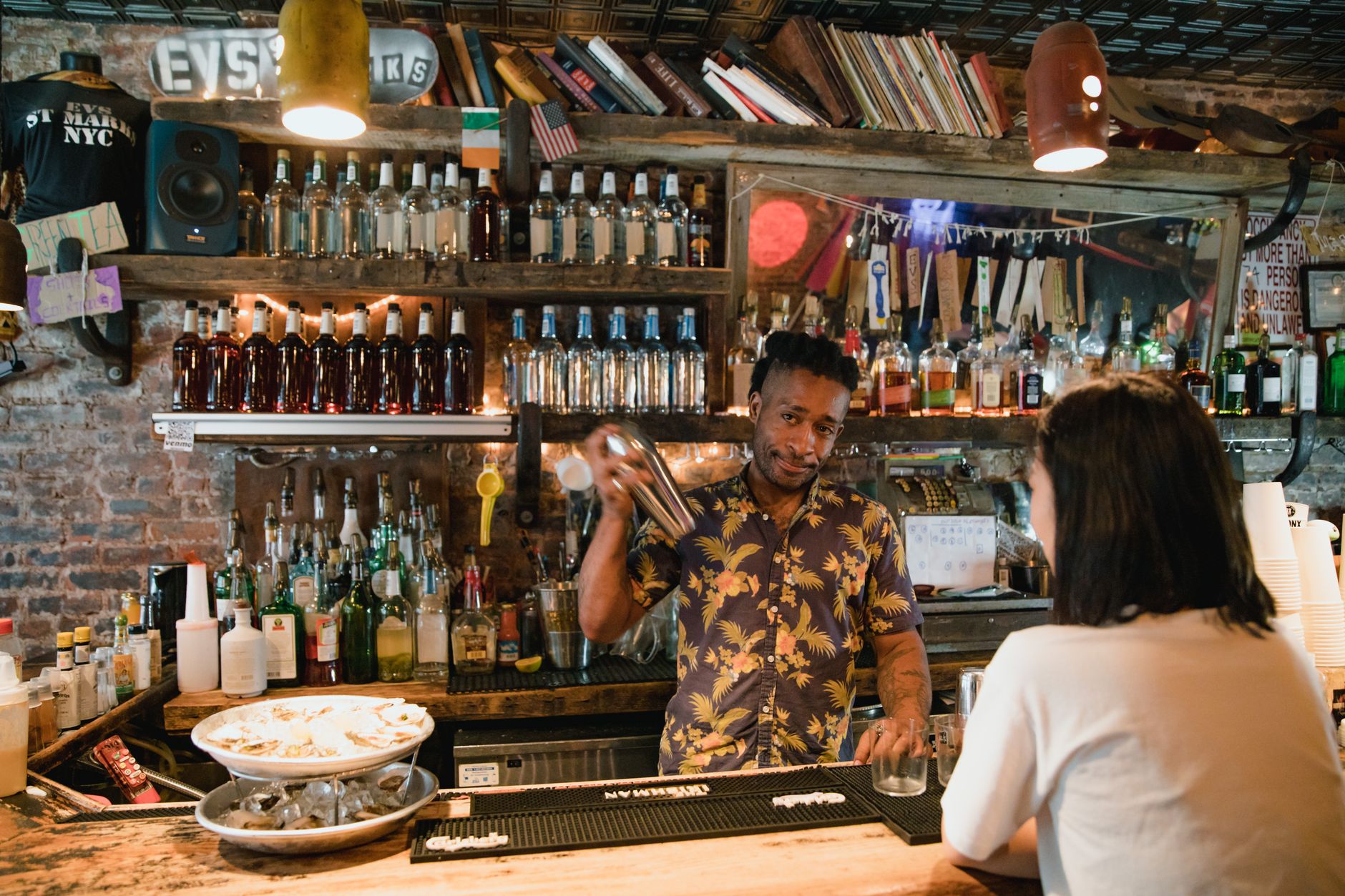 Bar counter with Japanese sake bottles at Sakagura