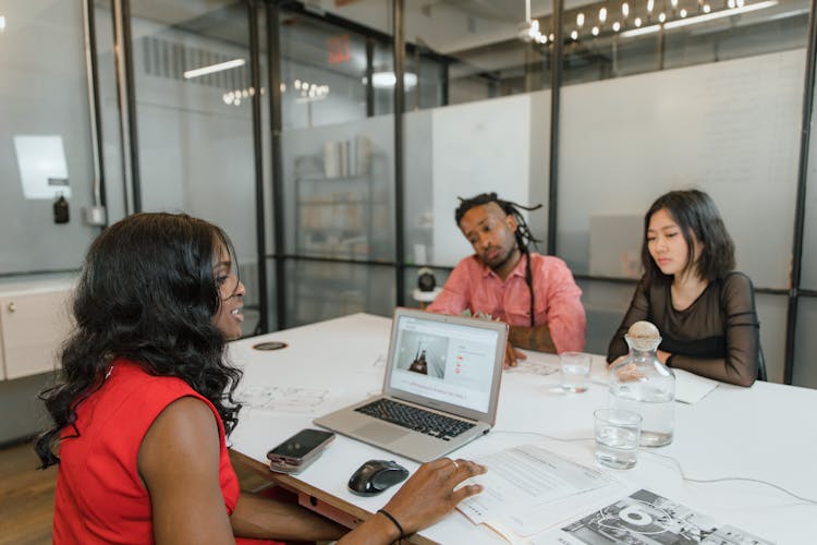 Businesspeople Having Meeting In Office