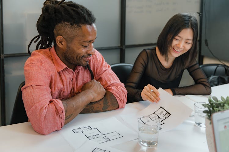 Architects Looking At Plans In Office