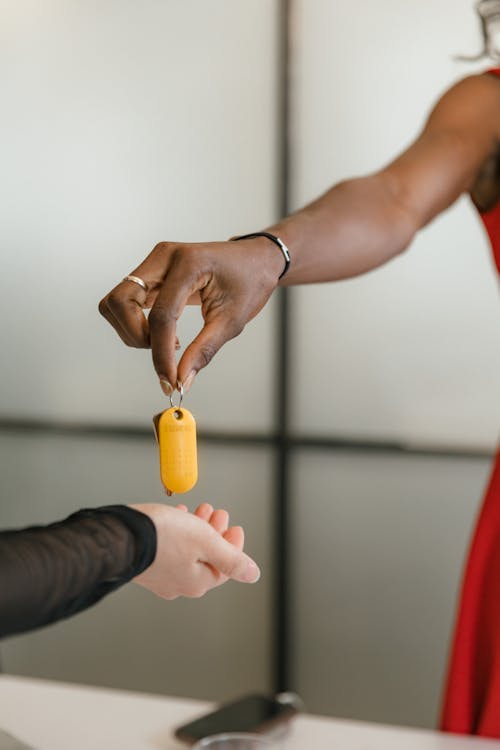 Person Handling Keys in Office 