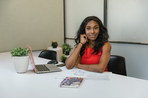 Free Woman Sitting at her Desk Stock Photo