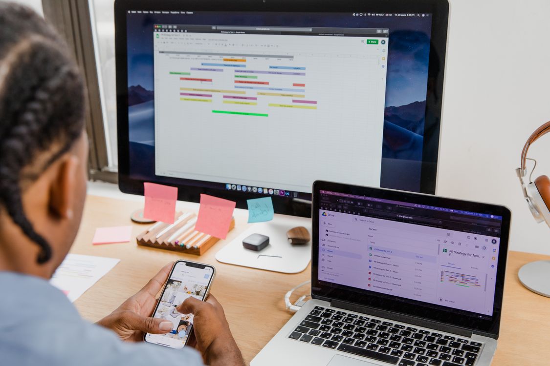 Man using smartphone while working · Free Stock Photo