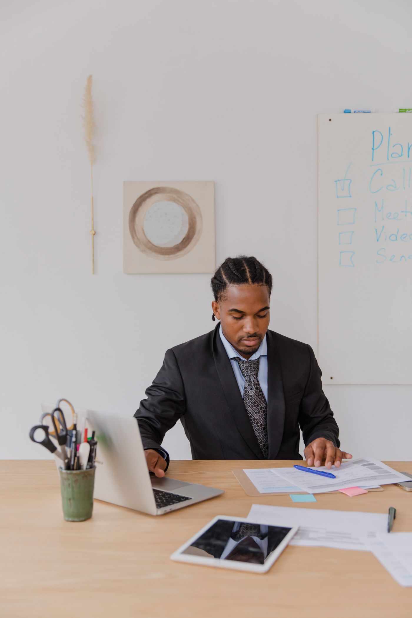 Business owner reviewing paperwork while working at a desk