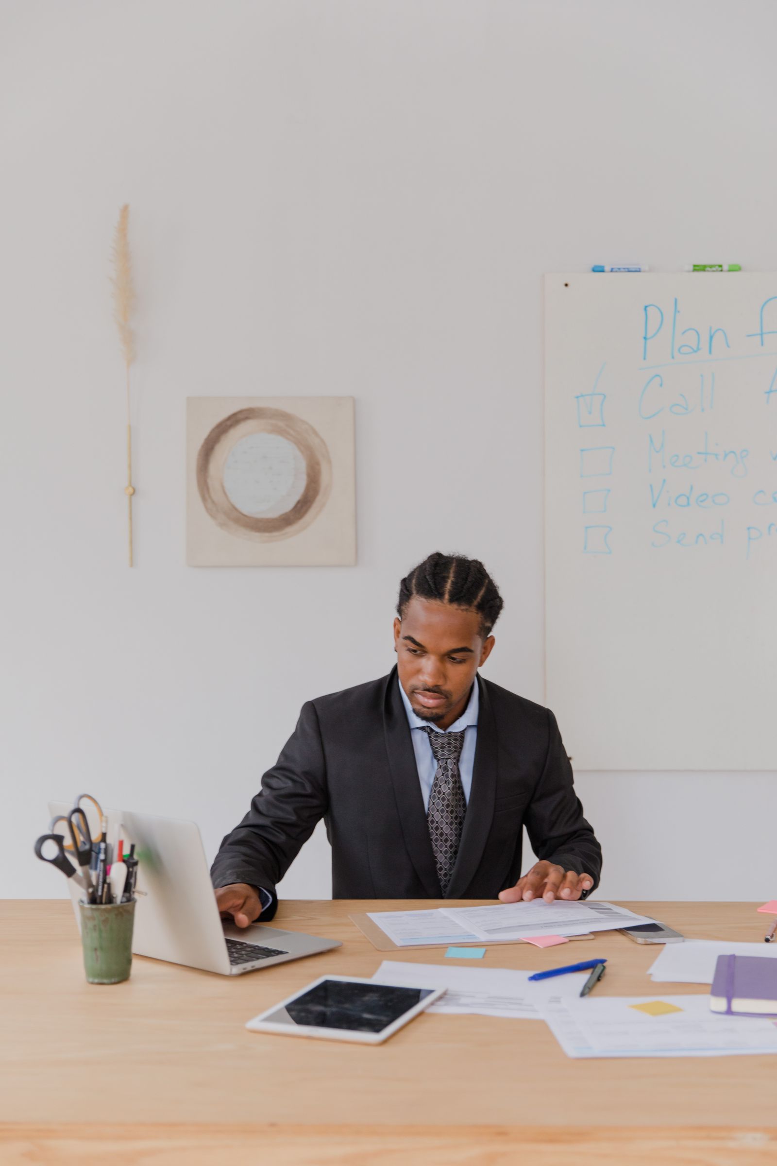 Black business owner working on financial planning in a modern office