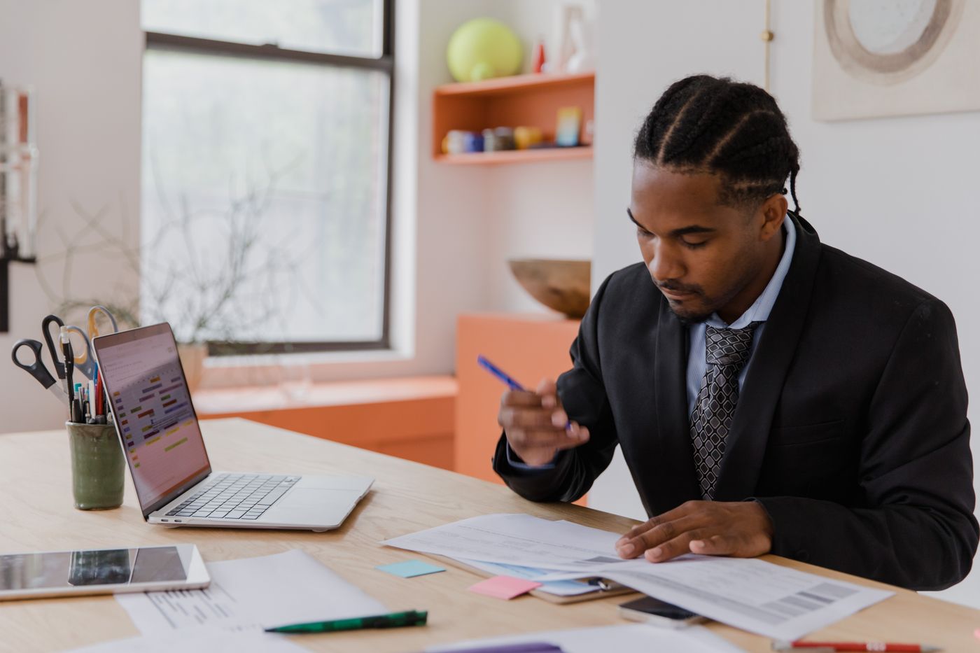 Professional reviewing documents at a desk