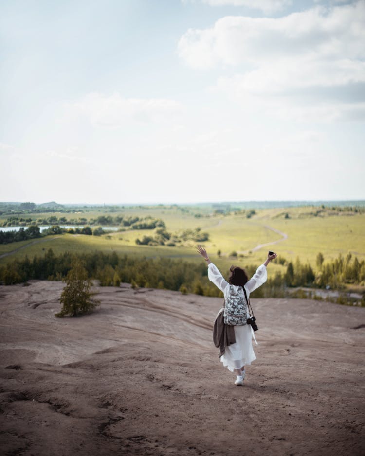 Woman Walking On Field