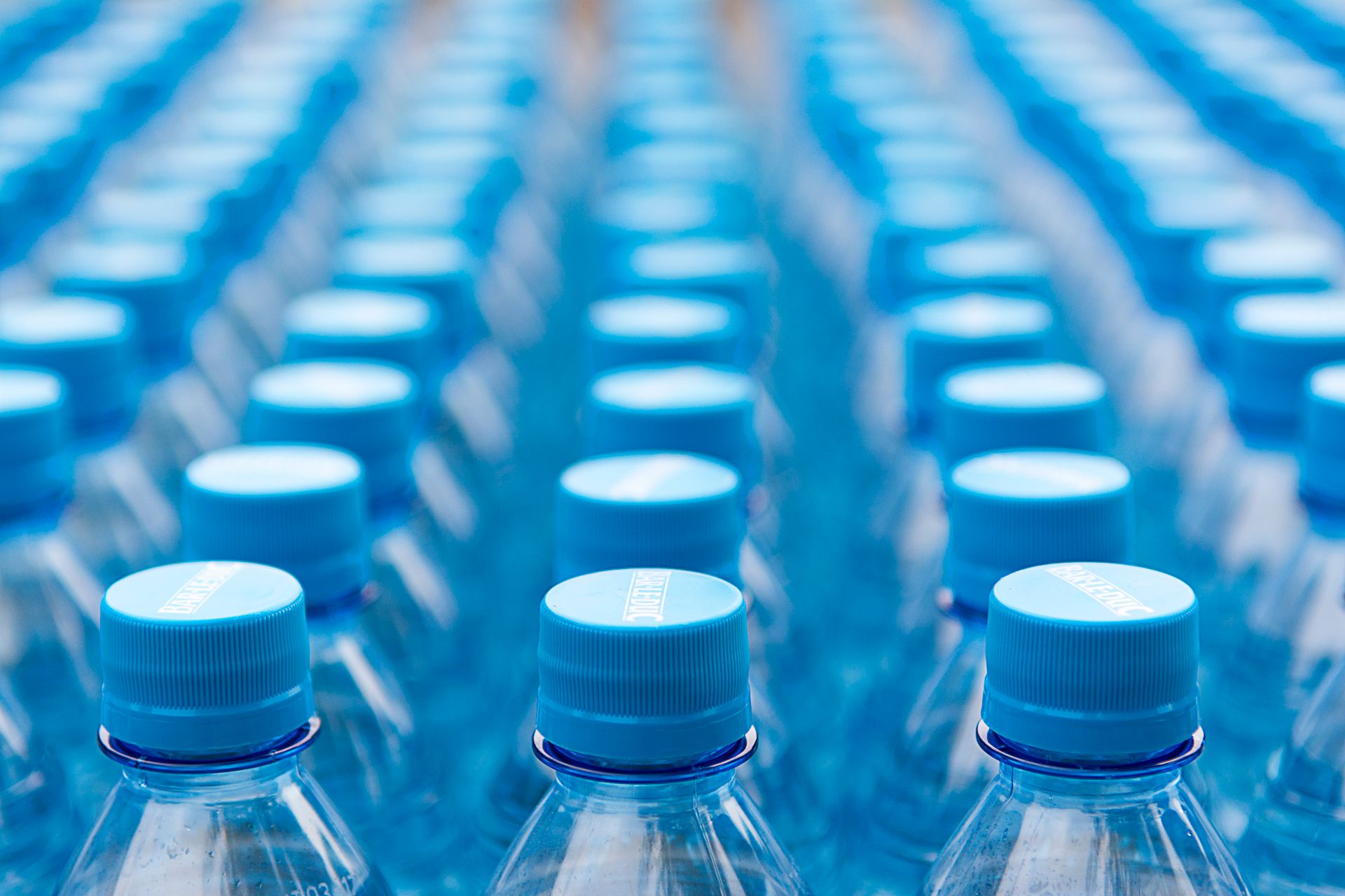 Array of blue plastic water bottles