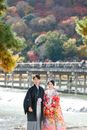 Man and Woman Standing on White Sand