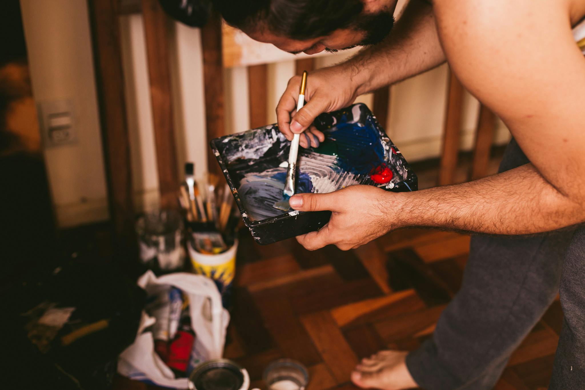 man holding paint brush