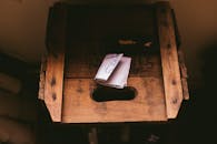 White Printing Paper on Brown Wooden Crate