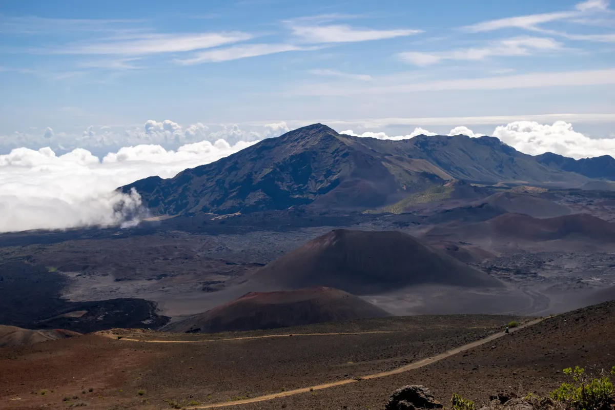The summit of Haleakala volcano on Maui rising above a sea of clouds