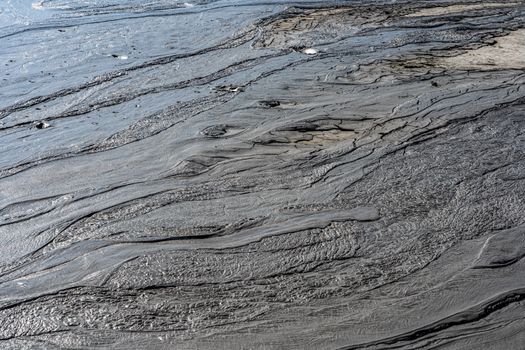dark black river mud