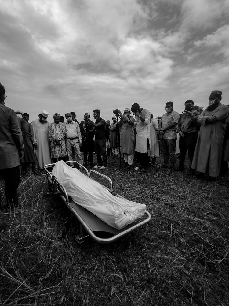 Crowd Around Deceased Man 