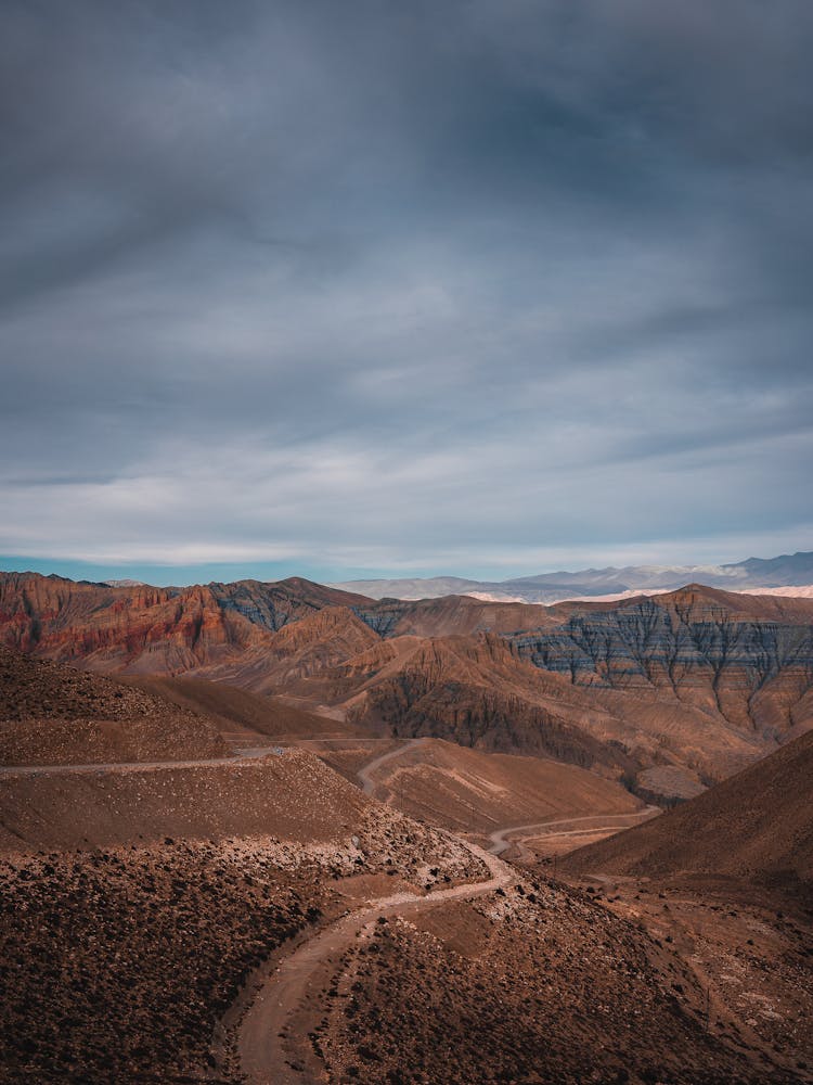 Road Vanishing In Red Desert Mountains