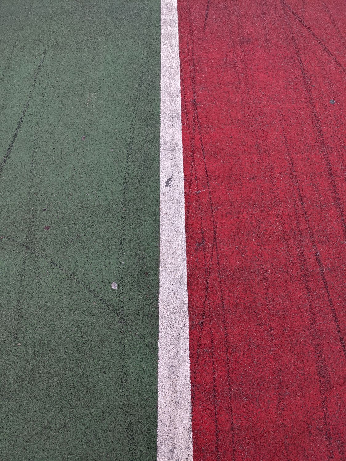Line Through Ground Line Between Red and Green Part of Ground · Free Stock Photo