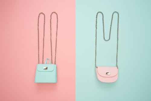 Free Photo of Two Teal and Pink Leather Crossbody Bags Stock Photo