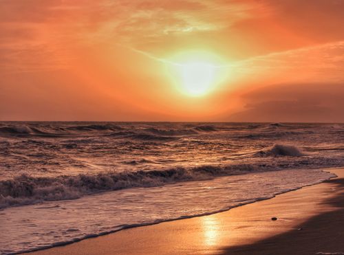 Free Beautiful sunset over the waves at Torre de Benagalbón, capturing a serene coastal scene. Stock Photo