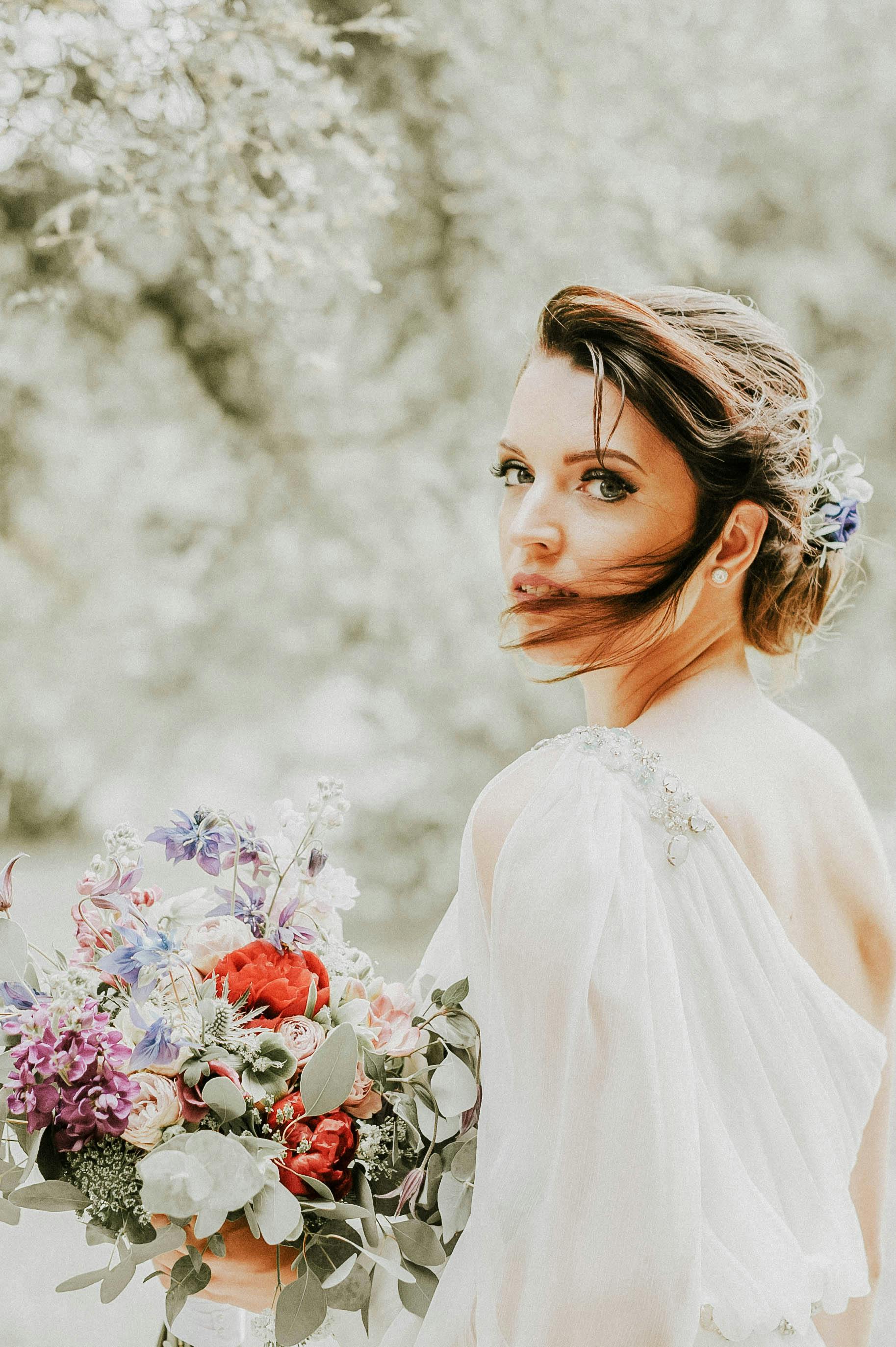 portrait of a bride with bunch of flowers