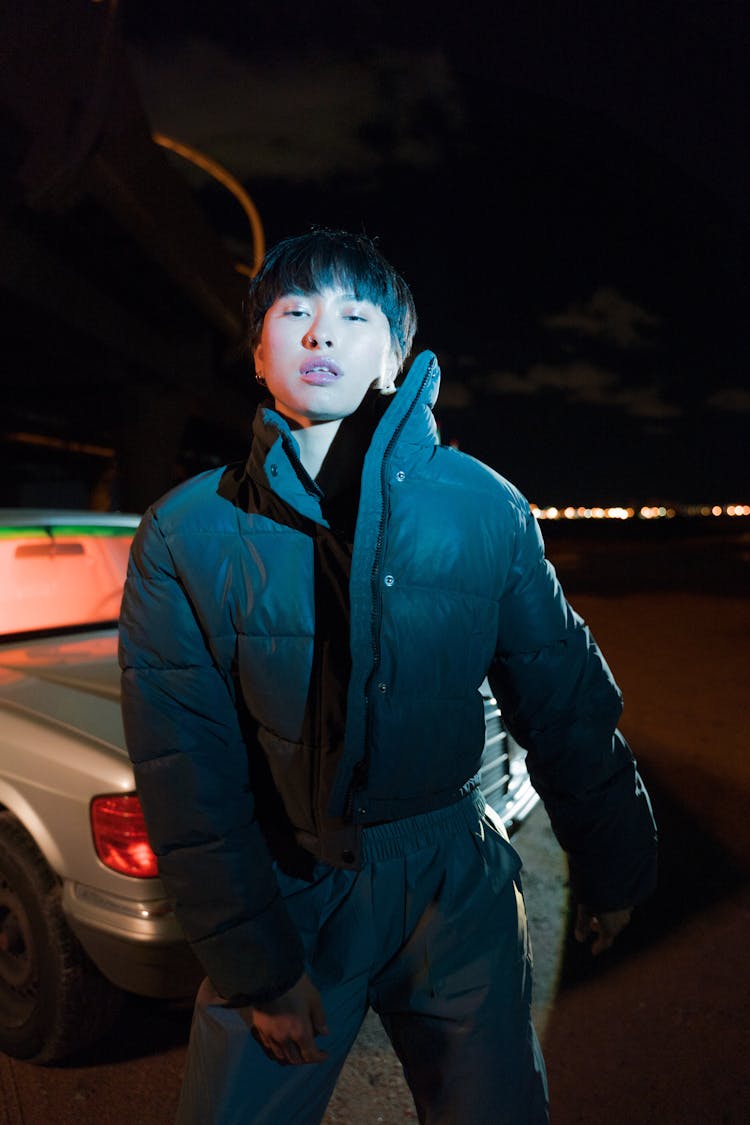 A Woman In Black Jacket Standing Near Car 