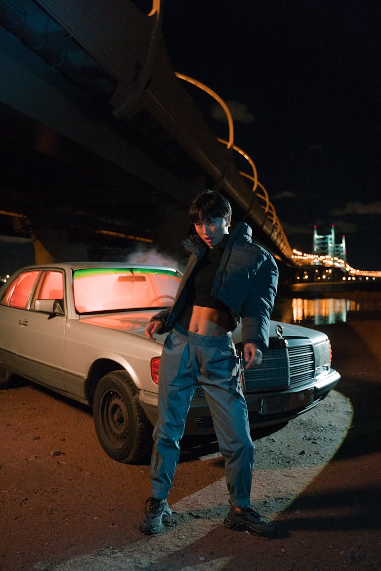 Woman Standing In Front Of A Car