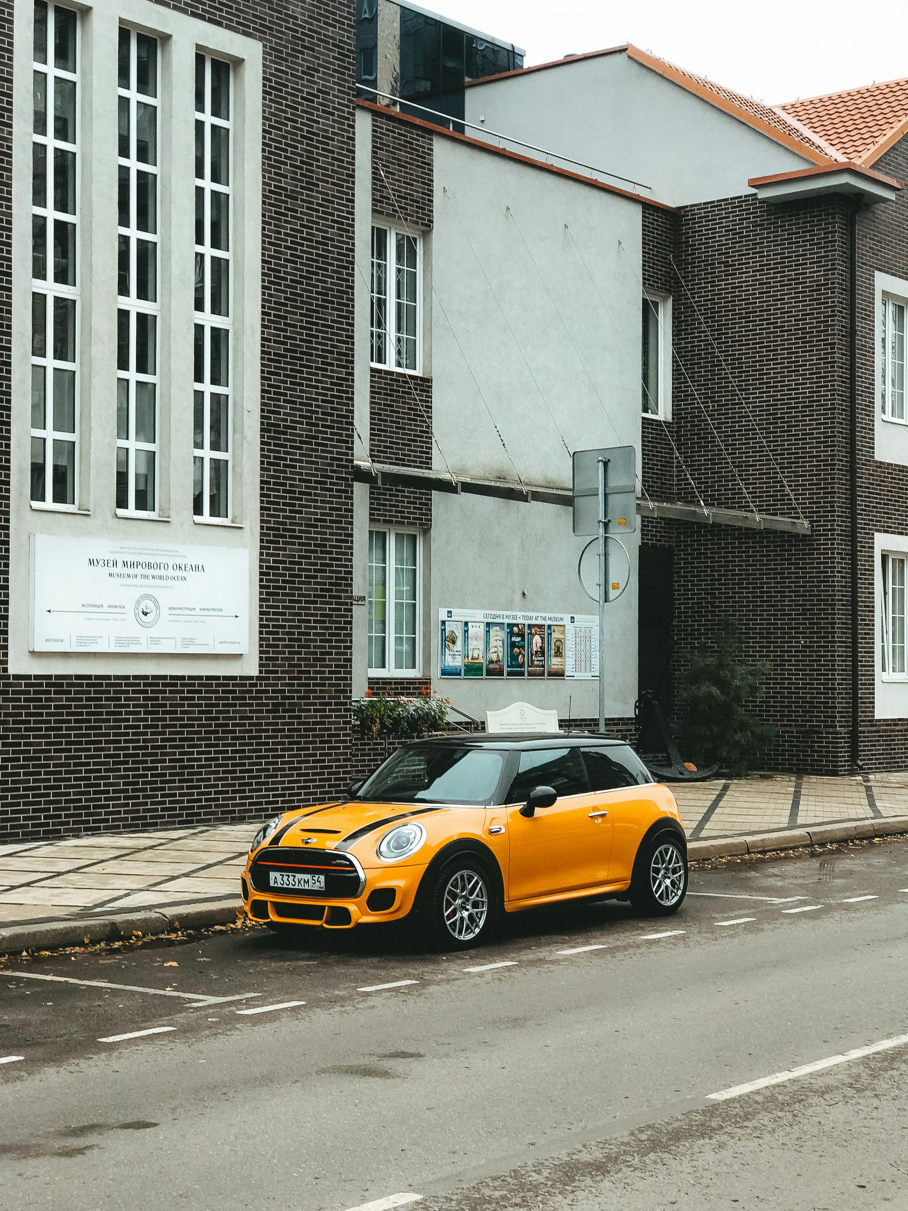 Free Yellow Car Parked on the Side of the Road Stock Photo