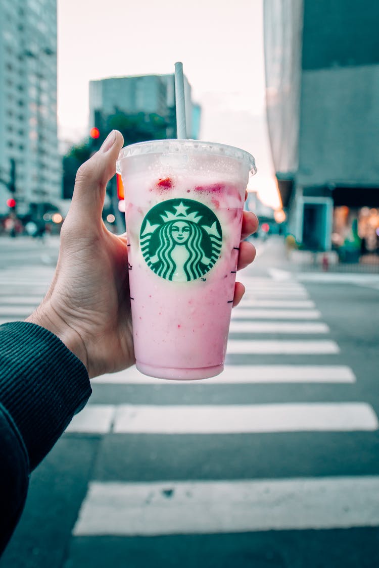 A Person Holding Starbucks Strawberry Milkshake