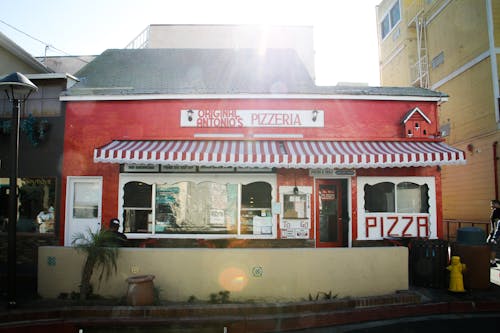 Free Red and White Pizzeria Cafe at Daytime Stock Photo