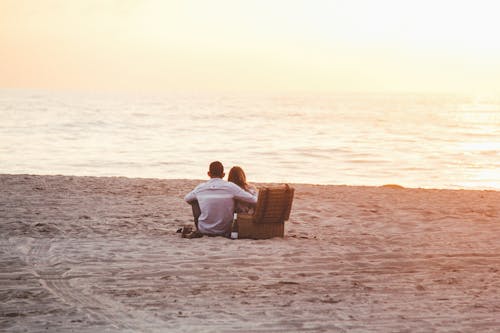 Couple at Beach Near Cooler