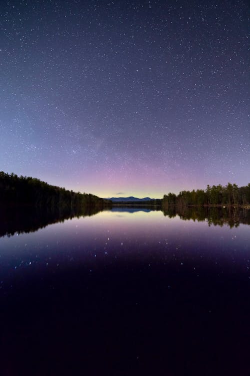 Blue Sea Under the Clear Sky during Night Time