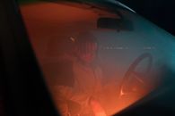 Man in Hoodie Jacket Sitting in the Car