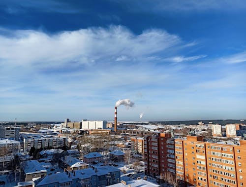 White Clouds over City Buildings