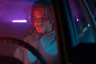 Man in Gray Hoodie Driving a Car