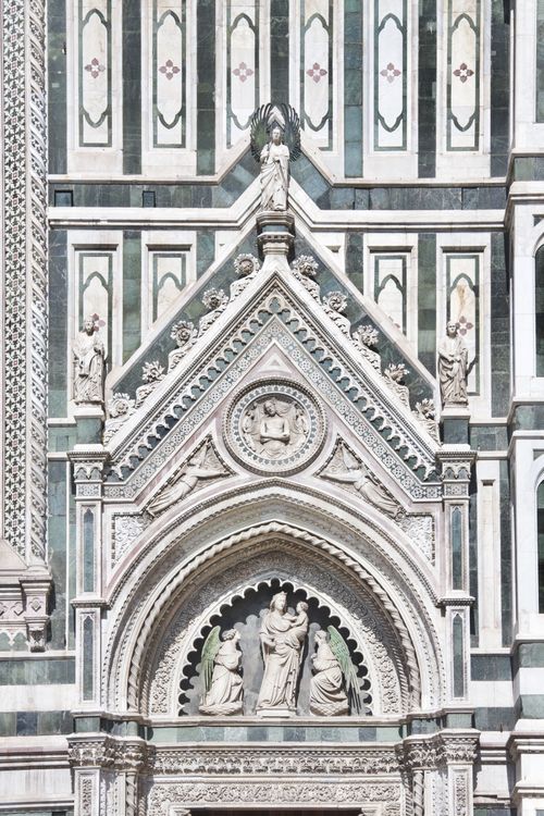 Free Close-up of the intricate facade of Florence Cathedral featuring ornate sculptures and architectural details. Stock Photo